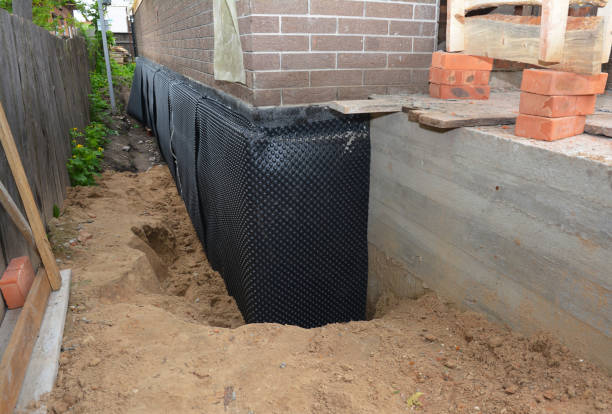 SJ Waterproofing Pros technician performing targeted Waterproofing assessment in Lake Bluff, IL